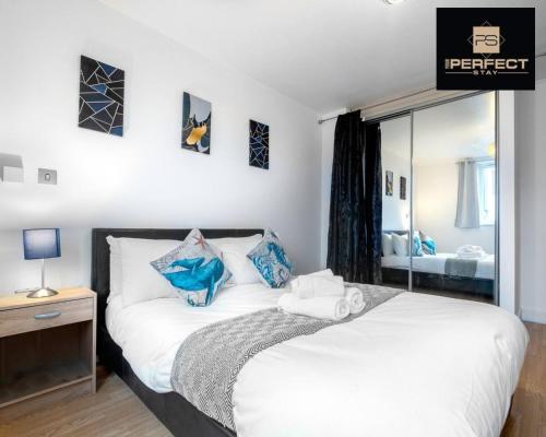 a bedroom with a white bed and a mirror at Mercury Suite CITY CENTRE Netflix Dedicated Workspace By Your Perfect Stay Short Lets Birmingham in Birmingham