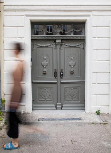 a person walking in front of a door at Sommerfrische Lychen in Lychen