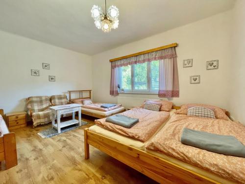 Postel nebo postele na pokoji v ubytování Chalupa U Josefa