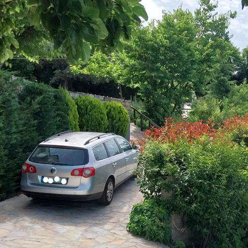 a silver car parked in a parking lot at Panorama Studio Afetes in Afétai
