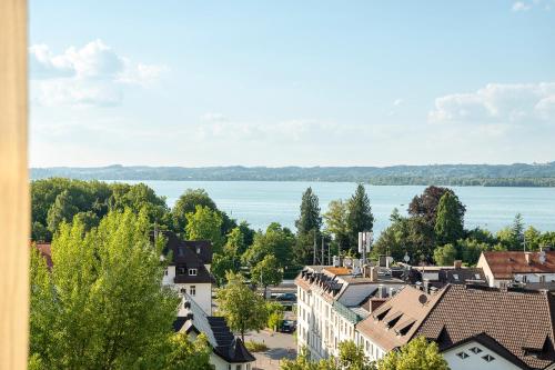 a view of a town with a large body of water at Seeblick Bregenz in Bregenz