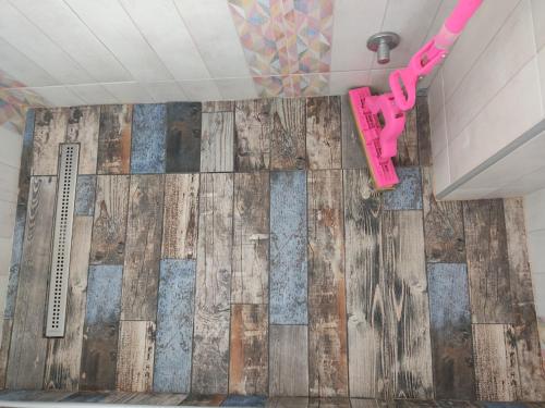 a room with a wall covered in reclaimed wood at Vintage Blue in Kumanovo