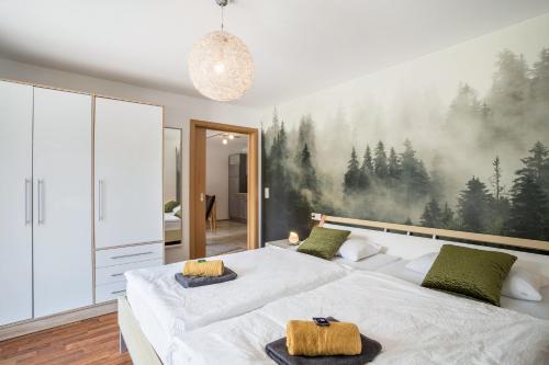 מיטה או מיטות בחדר ב-Ferienwohnung Hohfelsenblick