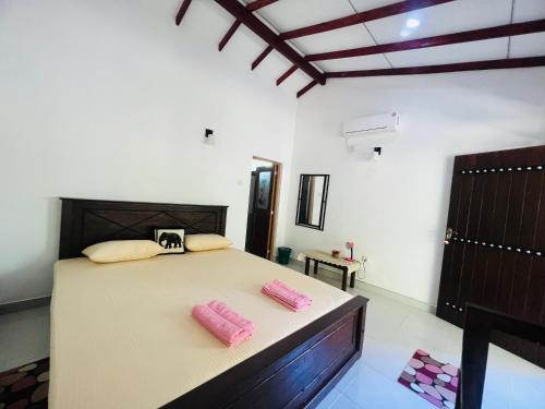 Ένα ή περισσότερα κρεβάτια σε δωμάτιο στο Harini Villa