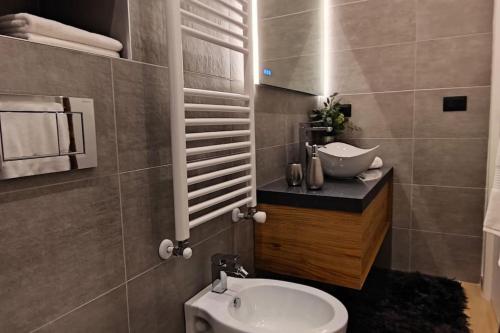 a bathroom with a sink and a toilet in it at Casa Relax - 500 mt. dal Centro in Turin