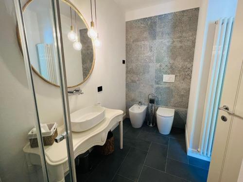 a bathroom with a sink and a mirror at Locanda alla Grotta in Crone