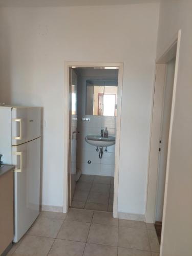 a small bathroom with a sink and a sink at Apartman AnaS in Drage