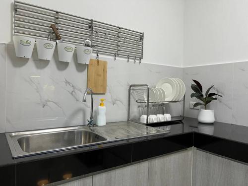 a kitchen with a sink and a counter top at MOST Family 456/66 Ubon-Thailand in Ubon Ratchathani