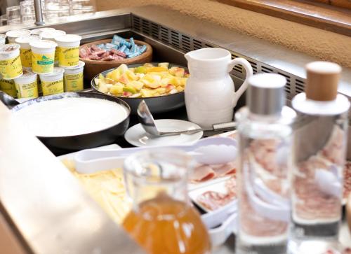a kitchen counter with a drawer full of food at Hôtel Restaurant Domaine de l'Adoux in Saint-Jean