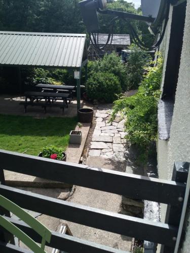 a view of a garden from the balcony of a house at NEWFIELD INN in Broughton in Furness