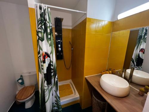 a bathroom with a sink and a shower at Marina et Piscine 4-5 pers in Saint-François