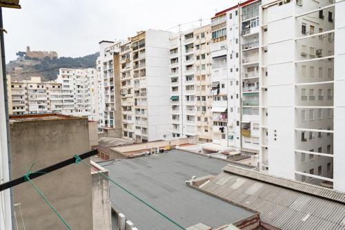 a view from the roof of a building with tall buildings at Provence, 5º-17 in Cullera
