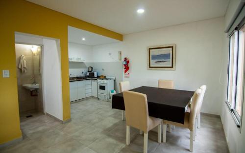 a kitchen and dining room with a table and chairs at Hacienda Don Justo Hotel Boutique Spa in Colón