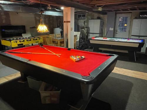 a ping pong table in a room with two pool tables at Catskill Mountain Retreat in West Kill