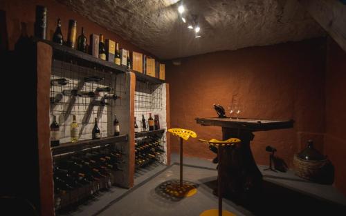 a room filled with lots of bottles of wine at Hacienda Don Justo Hotel Boutique Spa in Colón