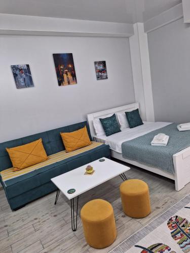 a living room with a couch and a table at kato's apartment in Tbilisi City