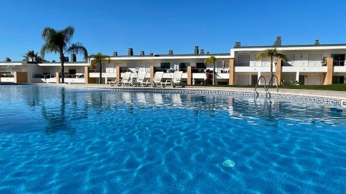 a large swimming pool in front of a building at Branca by Check-in Portugal in Albufeira