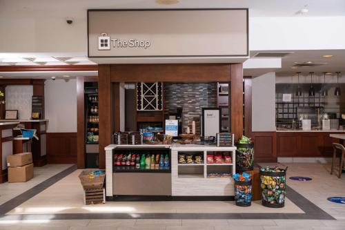 a coffee shop with a counter in a store at Hilton Garden Inn Erie in Erie