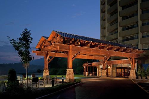 a wooden pavilion in front of a building at The Park Vista - A DoubleTree by Hilton Hotel - Gatlinburg in Gatlinburg