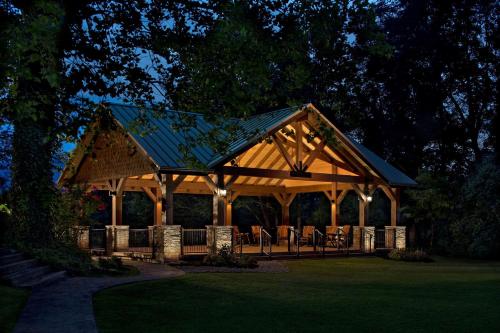 a pavilion with tables and chairs in a park at The Park Vista - A DoubleTree by Hilton Hotel - Gatlinburg in Gatlinburg