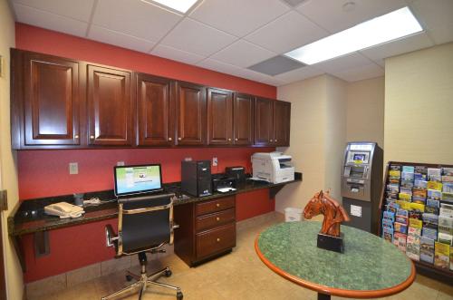 an office with a desk with a computer and a table at Hampton Inn Groton/Mystic in Groton