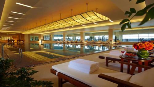 a swimming pool in a building with a poolasteryasteryasteryasteryasteryasteryastery at DoubleTree by Hilton Qinghai - Golmud in Golmud