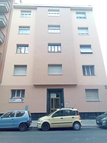 two cars parked in front of a building at B&B casa Liliana in Turin