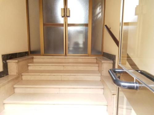 a set of stairs with a door and a window at B&B casa Liliana in Turin