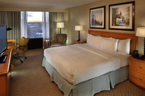 a hotel room with a large bed and a television at DoubleTree by Hilton Hartford Downtown in Hartford