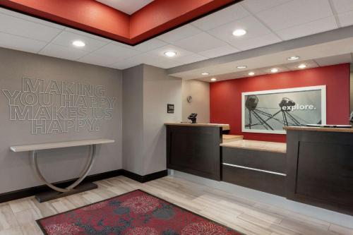 a hair salon with a sign that says making your happy makes us happy at Hampton Inn and Suites Houston Clear Lake NASA in Webster