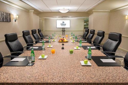 a large conference room with a long table and chairs at Hilton Houston Post Oak by the Galleria in Houston
