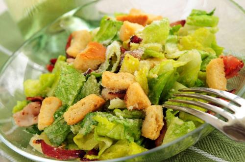 a salad in a glass bowl with a fork at Homewood Suites by Hilton Indianapolis Downtown in Indianapolis