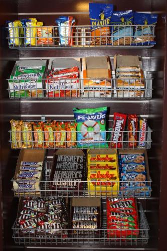 a refrigerator filled with lots of different types of food at Hilton Garden Inn Jackson/Pearl in Pearl