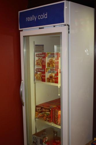 a refrigerator with a sign that says really cold at Hilton Garden Inn Jackson/Pearl in Pearl