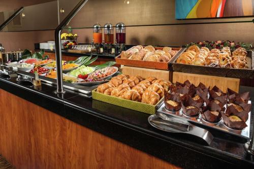 a buffet line with many different types of food at DoubleTree by Hilton Carson in Carson
