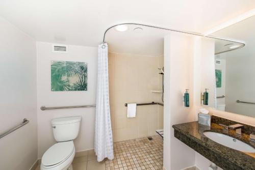 a bathroom with a toilet and a sink at DoubleTree by Hilton Carson in Carson