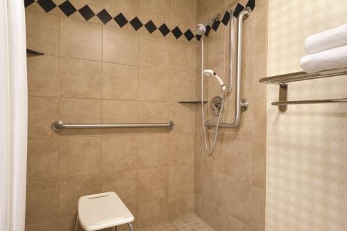a bathroom with a shower with a toilet at Hilton Garden Inn Lancaster in Lancaster