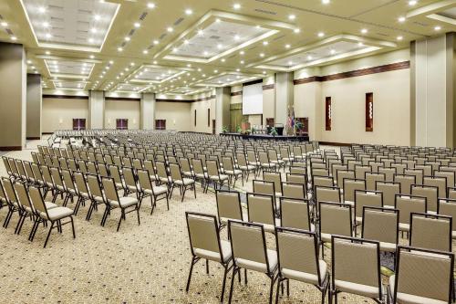 an empty room with rows of chairs in a hall at Hilton Garden Inn Manhattan Kansas in Manhattan