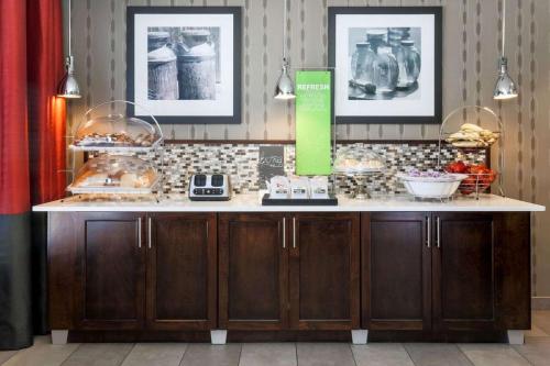 a counter in a restaurant with food on it at Hampton Inn Memphis-Southwind in Memphis