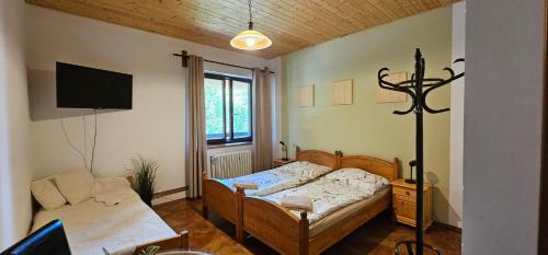 Postel nebo postele na pokoji v ubytování U Certa