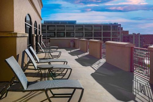 a row of chairs sitting on a balcony at Hampton Inn & Suites Country Club Plaza in Kansas City