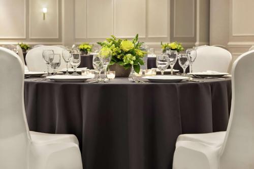 a table with a black table cloth and wine glasses at Hampton Inn and Suites New Orleans Convention Center in New Orleans