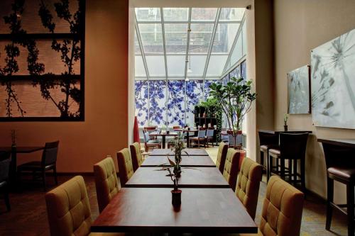 a dining room with a long table and chairs at Hilton Garden Inn New York/Manhattan-Chelsea in New York