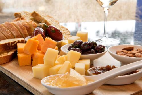 a tray of cheese and other foods on a table at Hilton Chicago/Oak Lawn in Chicago
