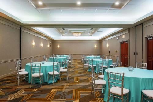 a conference room with blue tables and chairs at Hilton Chicago/Oak Lawn in Chicago