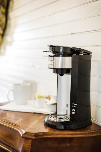 a coffee maker sitting on top of a table at Fairytale Loft Suite 1 bed, 1 bath Luxury Apartment in Downtown Belmont in Charlottesville