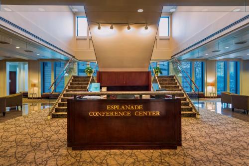 a conference center with stairs in a building at DoubleTree Suites by Hilton Hotel & Conference Center Chicago-Downers Grove in Downers Grove