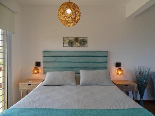 Postel nebo postele na pokoji v ubytování Los Caracoles Piscina & Spa