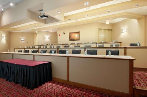 a large room with a row of chairs in it at Hilton Phoenix Airport in Phoenix