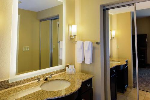 a bathroom with two sinks and a shower at Homewood Suites by Hilton Phoenix Chandler Fashion Center in Chandler
